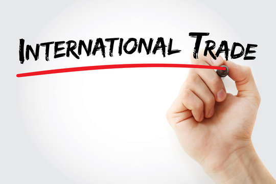 Hand writing international trade with marker, concept background