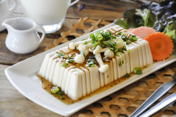 tofu with milk on the wooden table