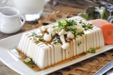 tofu with milk on the wooden table