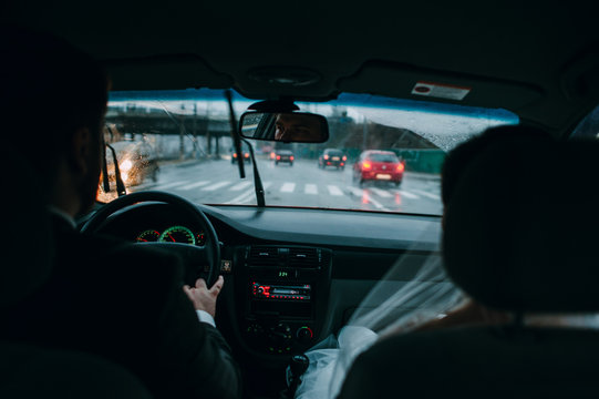 man and woman in the car