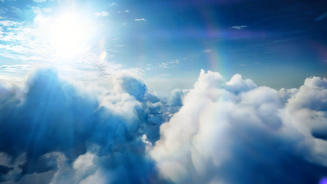 Flying over the timelapse clouds with the afternoon sun. Flight through moving cloudscape with beautiful lens flare. Traveling by air. Perfect for cinema, background