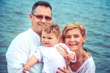 Happy family on the beach.