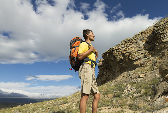 young male hiker in the mountains, mountain walk