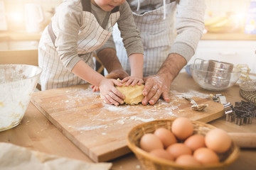 A father and his son cooking