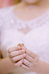 Hand of lover are wearing a ring on her wedding day