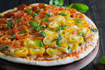 Pizza with mozzarella and cherry tomatoes