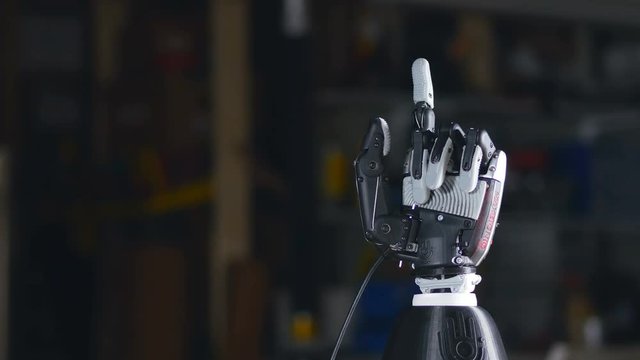 Bionic arm. Innovative robotic hand made on 3D printer. Futuristic technology. 4K.