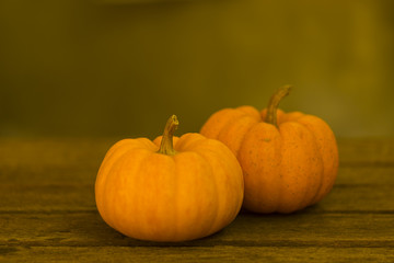 Pumkin or pumkin stillife on old wooden background. Autumn stillife dark tone.