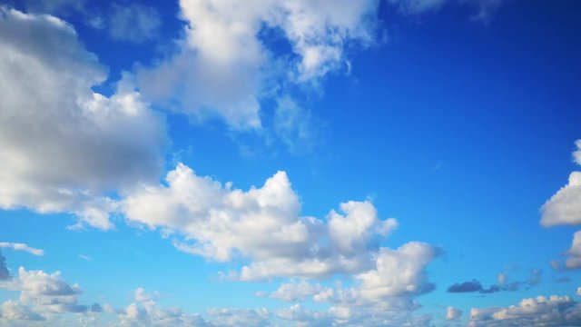 Timelapse shot of beautiful clouds rolling over sky. Aerial footage of cloudscape against blue sky. Idyllic view of nature on sunny day. 4K resolution.
