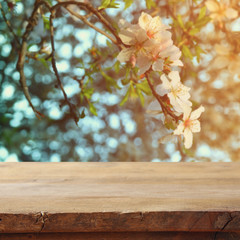 wooden table in front of cherry tree