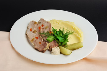 cold boiled pork with potato puree and pickled cucumber