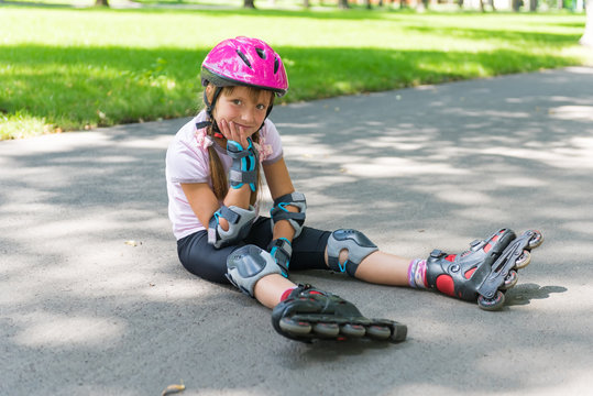 Little girl on roller skates at park