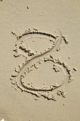 Numbers written on the sand