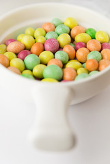 Many colorful jelly beans in a sweet glaze