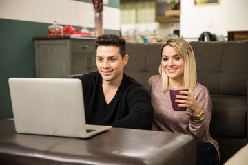 Cute couple relaxing together at home