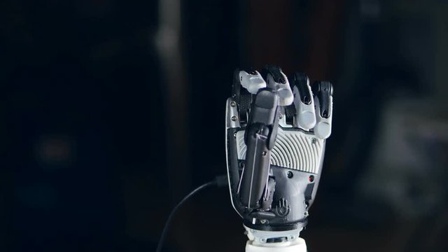 Bionic arm. Innovative robotic hand made on 3D printer. Futuristic technology. 4K.
