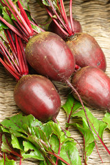 Fresh raw beetroots on leaves