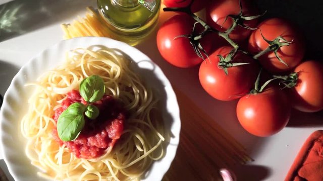 Dish with spaghetti and tomato sauce