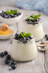 Natural homemade yogurt with blueberry and mint, selective focus