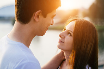 Happy couple in love having fun outdoors and smiling