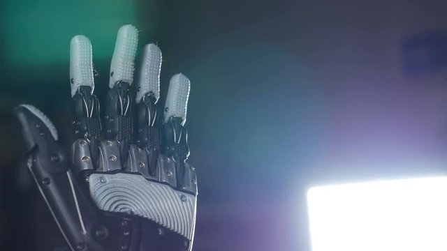 Bionic arm. Innovative robotic hand made on 3D printer. Futuristic technology. 4K.