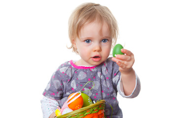 baby girl with easter eggs