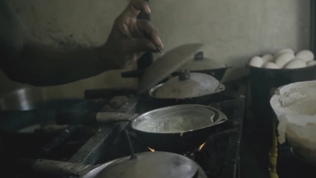 Traditional way of baking the rotti, indian food, authentic street chef, Sri Lanka, Weligama, January 12