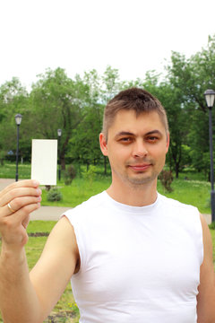 Middle age happy smiling man show white card