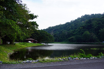 Fototapeta na wymiar Mountain and lake with Small cottage at Sam lan National Park
