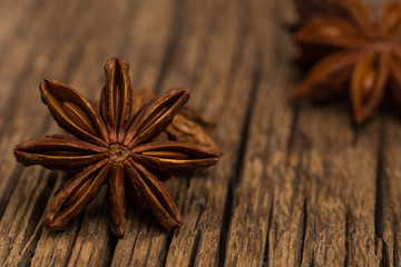 Star anise on old wooden table.