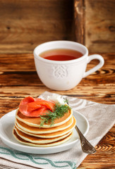 Potato and cheese pancakes with salted red fish cream cheese and dill. Breakfast. Selective focus
