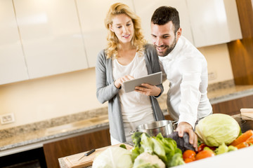 Young couple cooking in the modern kitchen