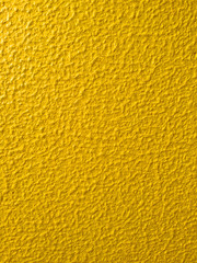 Yellow painted textured bumpy background with space for text. Can be used as a background for Easter and other occasions.
