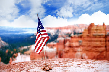 American flag with Bryce Canyon National Park on background