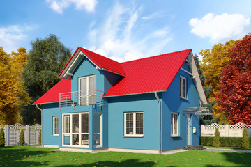 Ein blaues Einfamilienhaus in blühender Natur im Herbst am Tag.