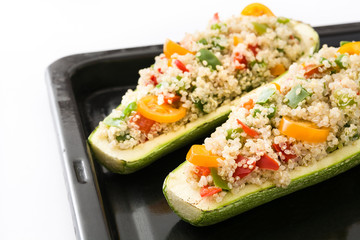 Stuffed zucchini with quinoa and vegetables, isolated on white background
