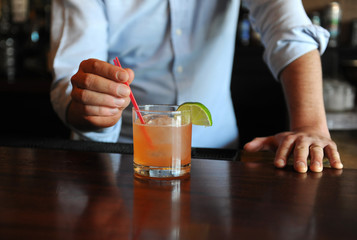 Bartender serving a cocktail