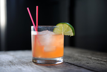 Cocktail on a bar with lime