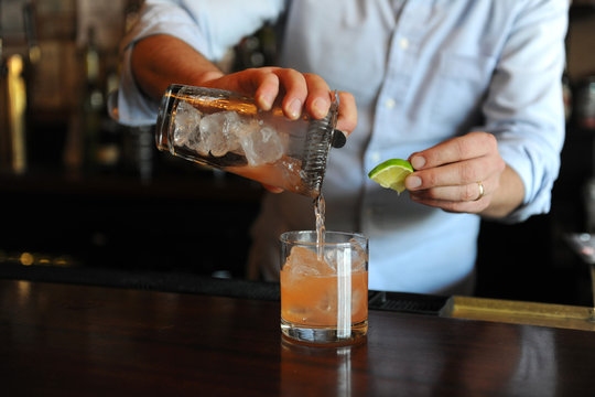 Bartender Pouring A Cocktail