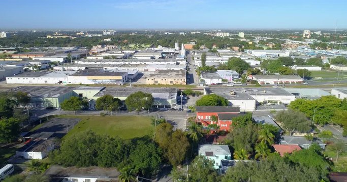 Stock drone footage of a warehouse district with railroad tracks