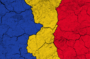 Flag of Romania on rugged wall full of scratches - metaphor of problem and crisis leading to collapse of Romanian country 