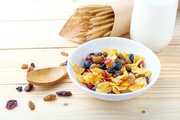 Corn flakes and Berries on wooden background