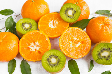 Fresh fruit tangerine, orange and kiwi close-up