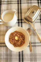 Breakfast on checked table-cloth boiled buckwheat with butter  