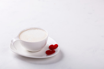 White Coffee Cup with Milk on a light Background.
