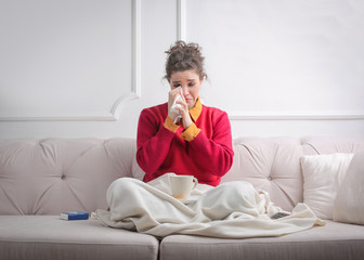 Beauty crying on the sofa