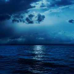Foto op Canvas dark clouds in night with moonlights over water © Mykola Mazuryk