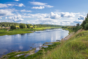 Fototapeta na wymiar Sukhona river and Totma city on its opposite bank, Vologodskaya region, Russia