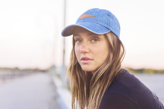 Portrait of woman wearing cap against clear sky