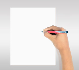Hand with pen writing on white paper